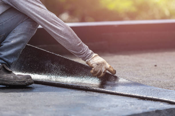Professional Exterior Waterproofing technician working in Marquette, MI